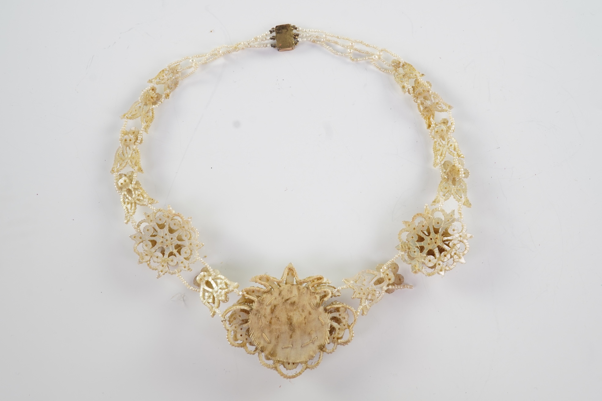 A Regency seed pearl necklace, brooch and pair of earrings, early 19th century
